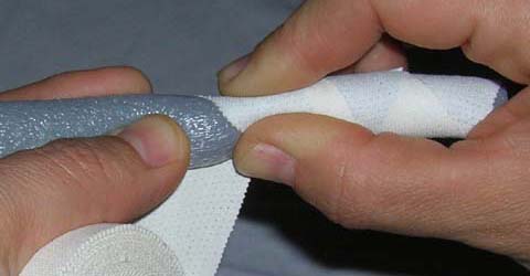 First step for ear taping method. Start taping firmly around the rod to achieve the flexible 
but tight ear-stick.