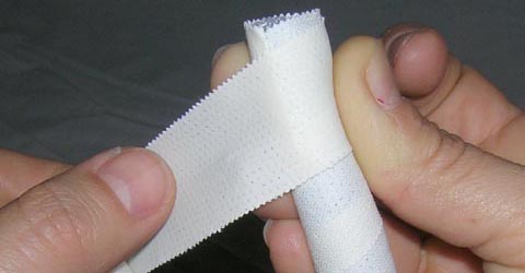  Step 3 for ear taping method:  Continue taping until all of the surface of the rod is taped with the sticky surface facing outwards.
